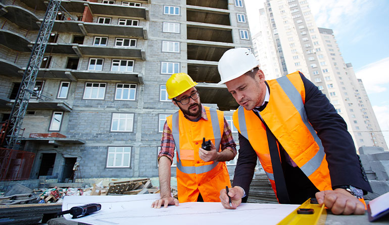 Engineers looking at plans